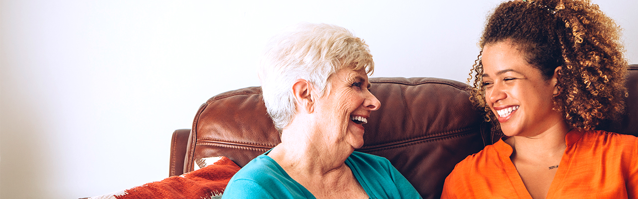 picture of a happy female senior laughing together with a team member