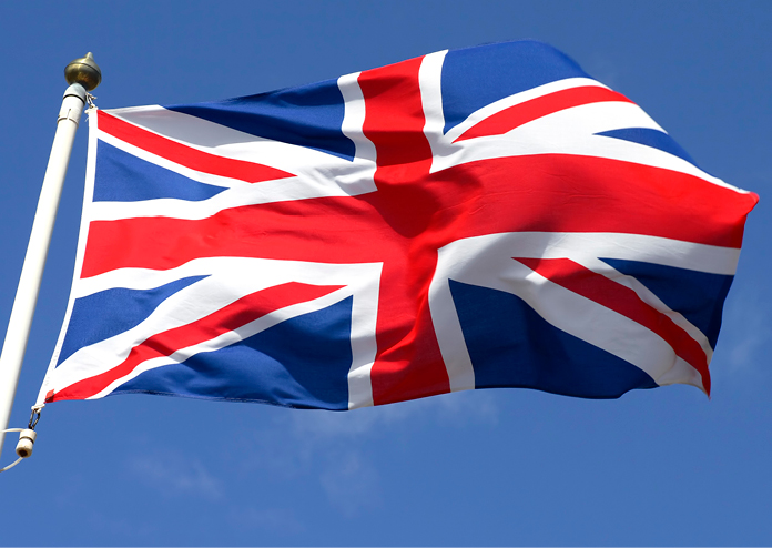 Image of United Kingdom flag flying in the sky