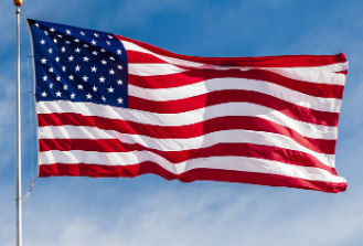 Image of USA flag flying in the sky