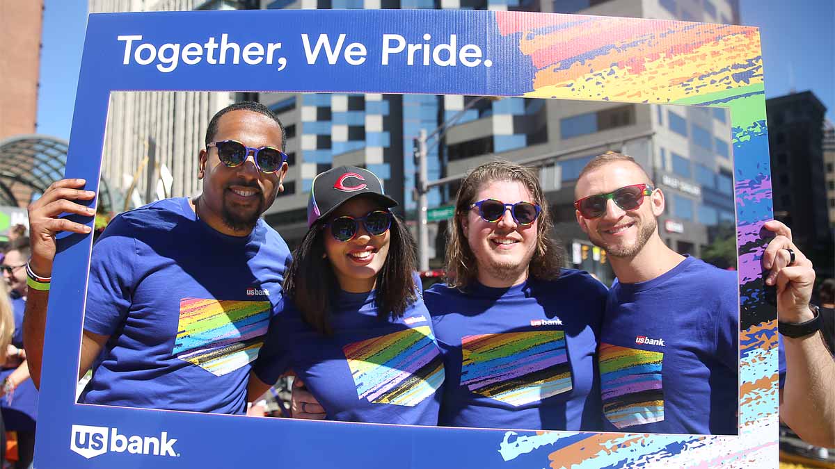 U.S. Bank employees with Proud to serve frame around faces