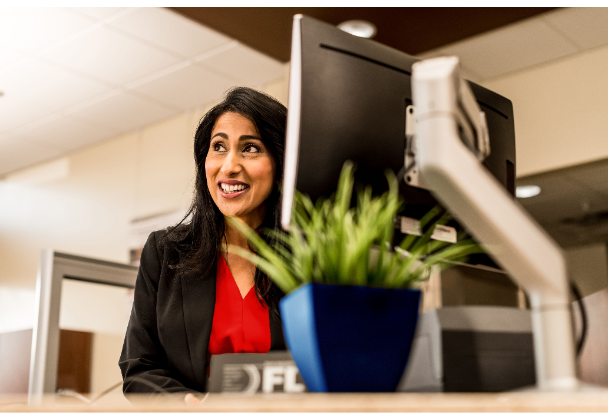 Woman at computer smiling