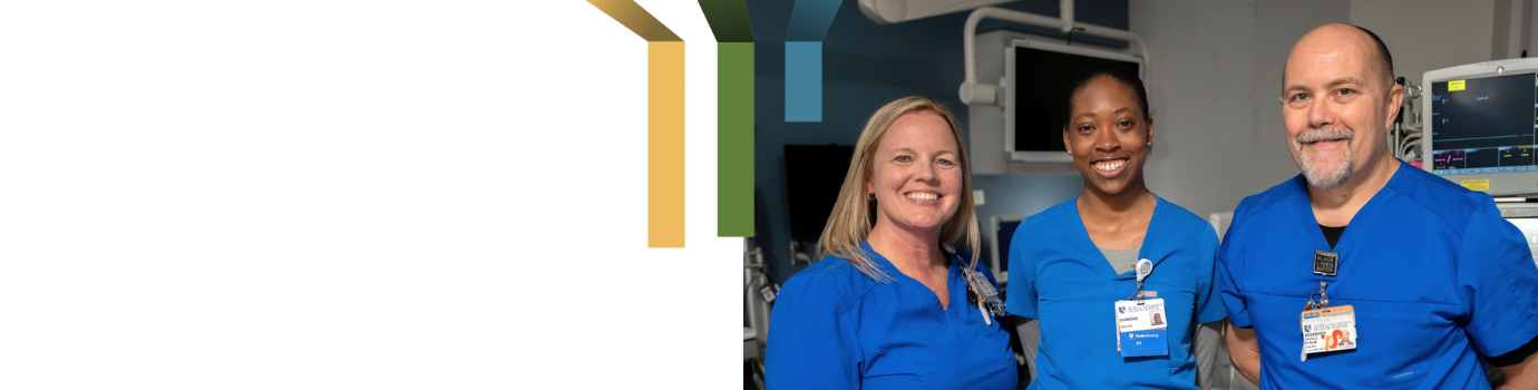 two female and one male nursing team member smile together in patient room.