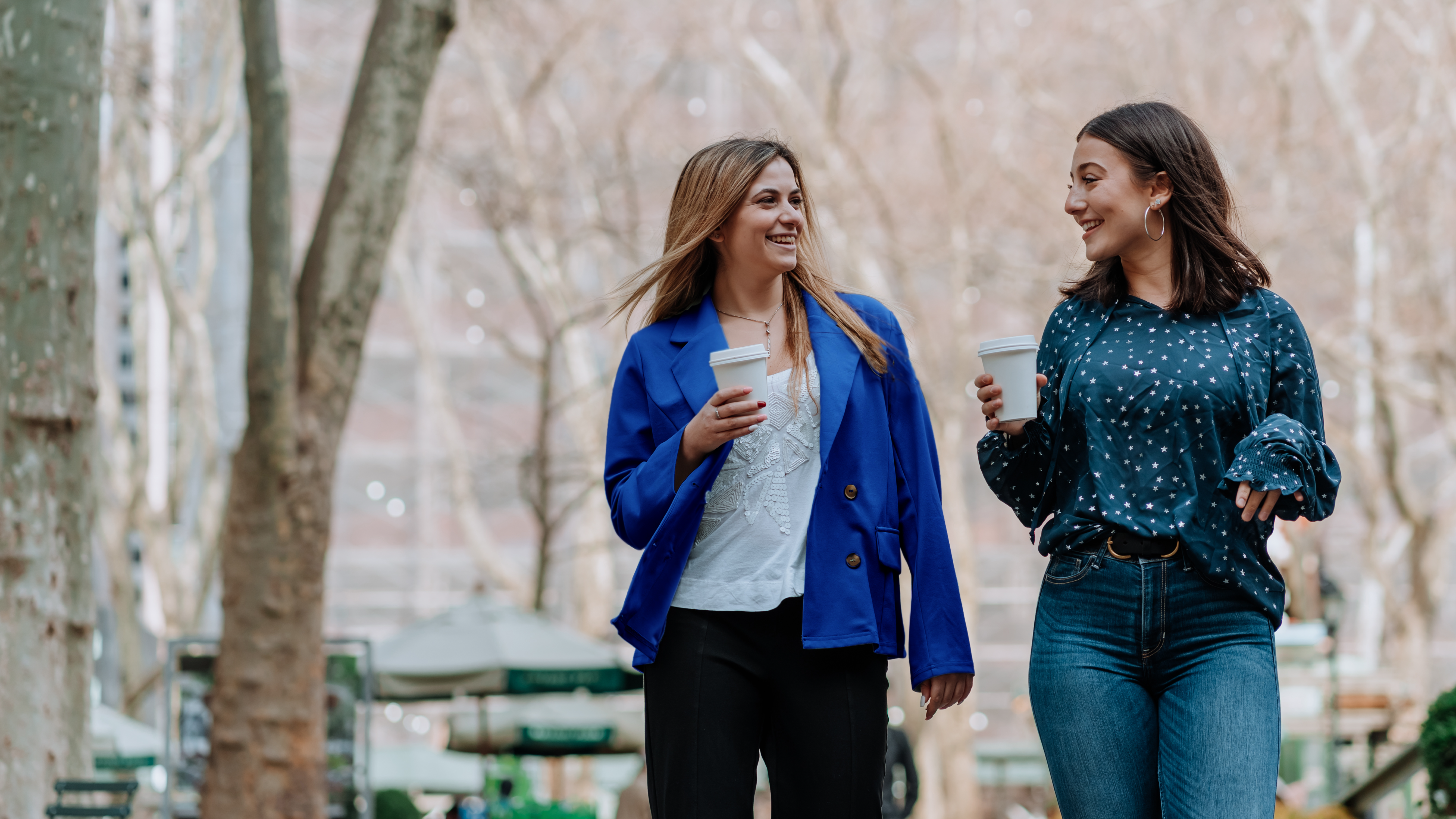 two women walking and talking