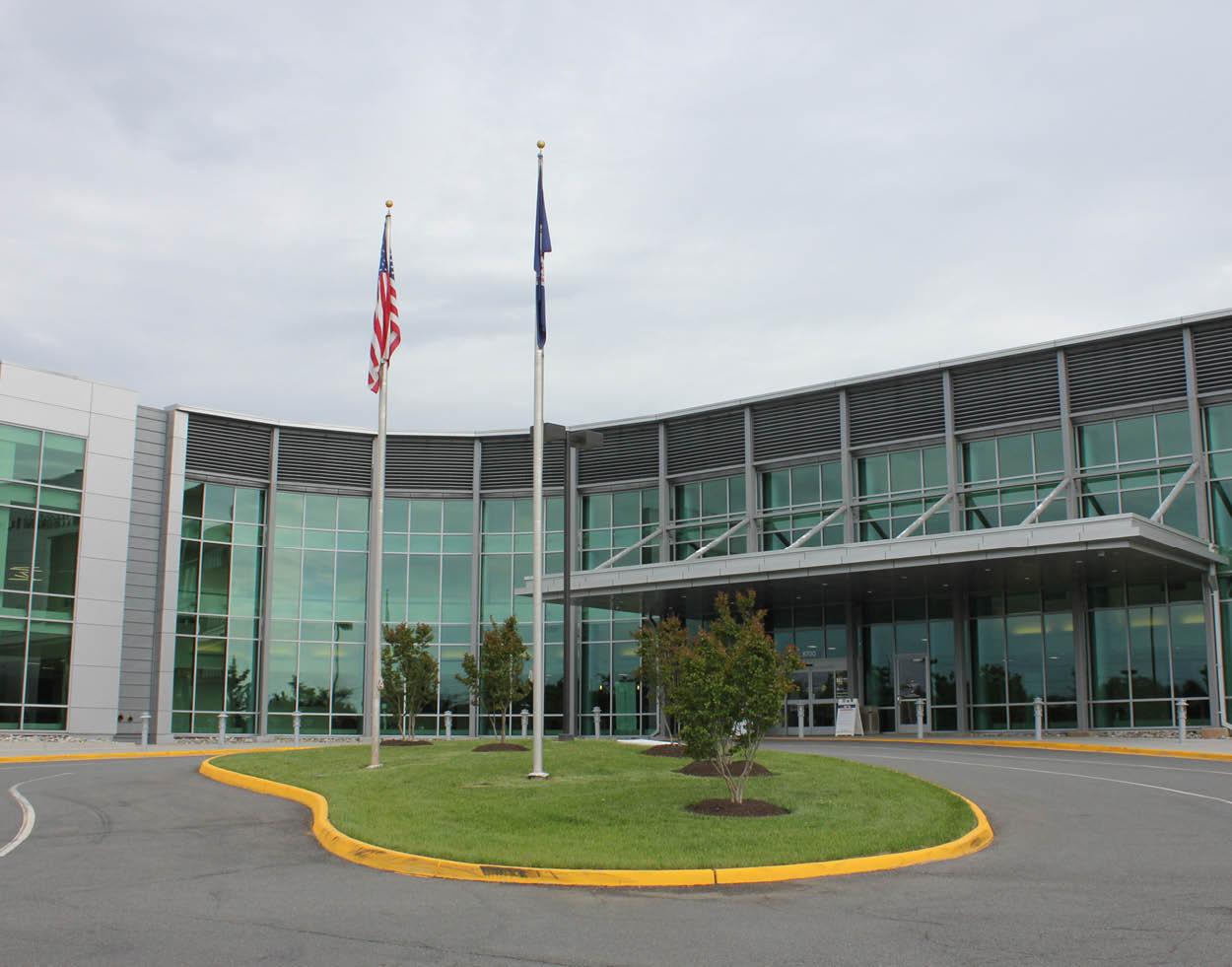 Community Health Medical Center exterior with two flags and cloudy sky